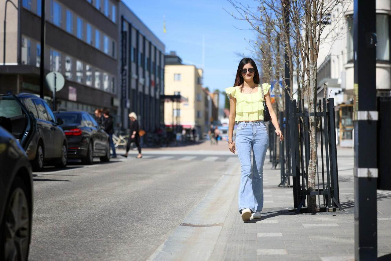 a woman walking down the street